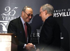 Mitch McConnell and Chuck Schumer shaking hands
