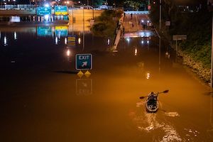 Kayaker paddling on highway