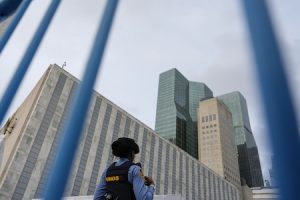 Person walking by building